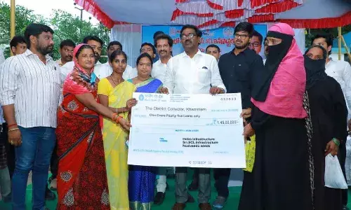 Distribution of flood relief aid in Khammam