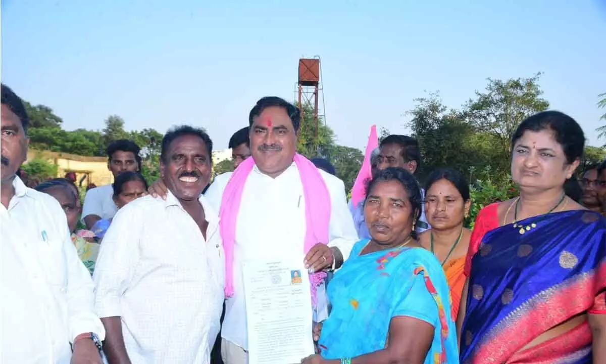 Land ownership papers distributed to SC beneficiaries in Warangal