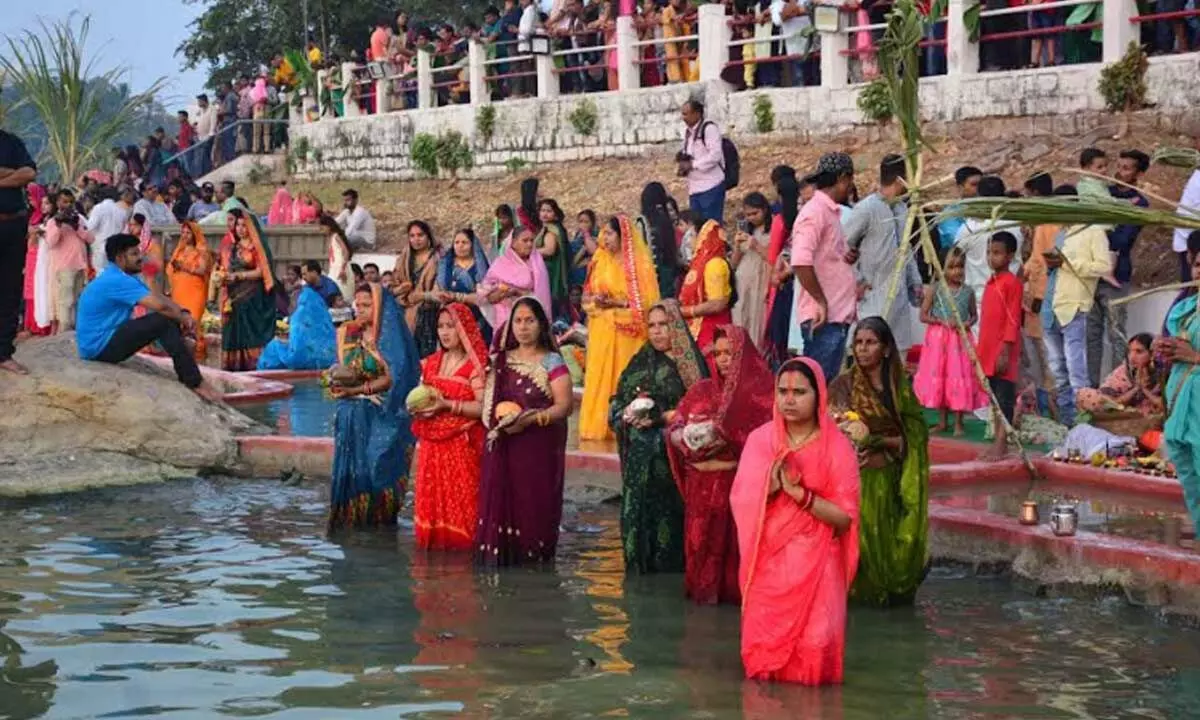 Devotees worship solar god as Hyderabad glows in Chhath Puja splendor