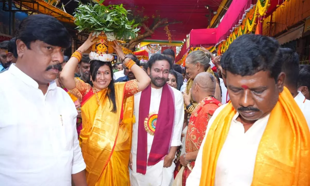 Kishan Reddy and his wife offer prayers at Ujjain Mahankali Temple