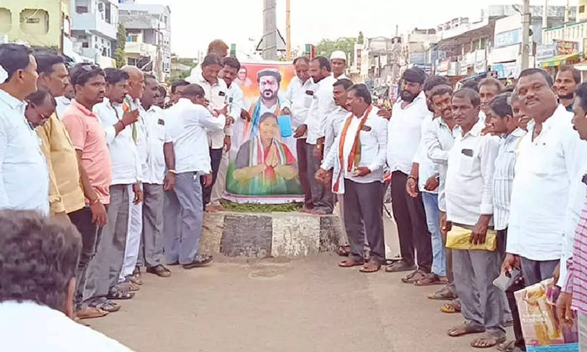 Photos of CM and Minister Seethakka receiving Palabhishekam