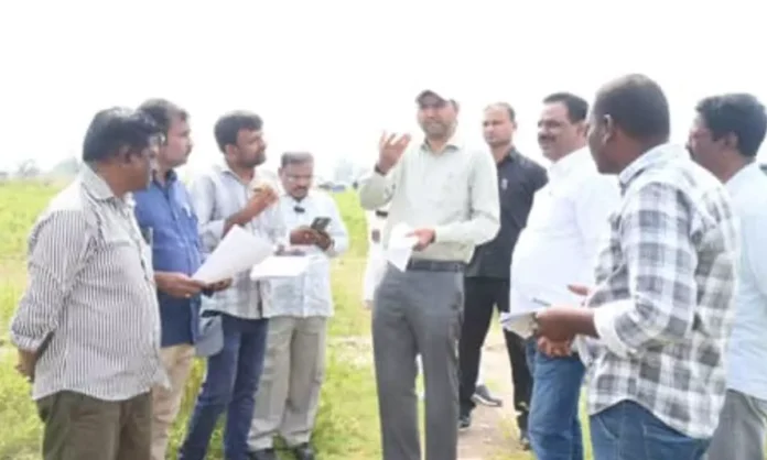 District Collector Urges Swift Resolution of LRS Applications Following Field Inspection in Erravalli