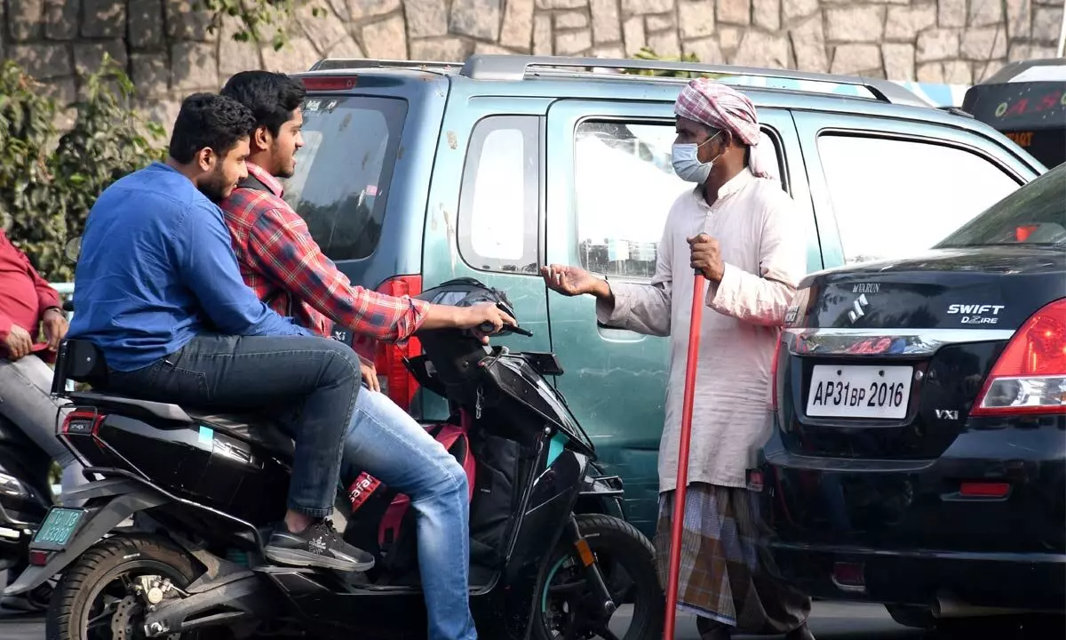 Beggars dominate traffic signals