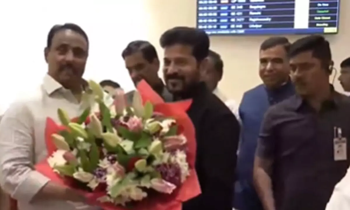 CM Revanth Back from Davos, Gets Warm Welcome in Hyderabad