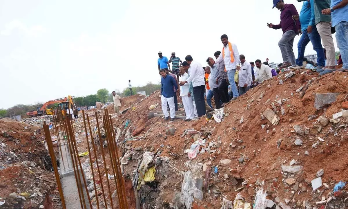 Residents protest against graveyard being used as a dump yard